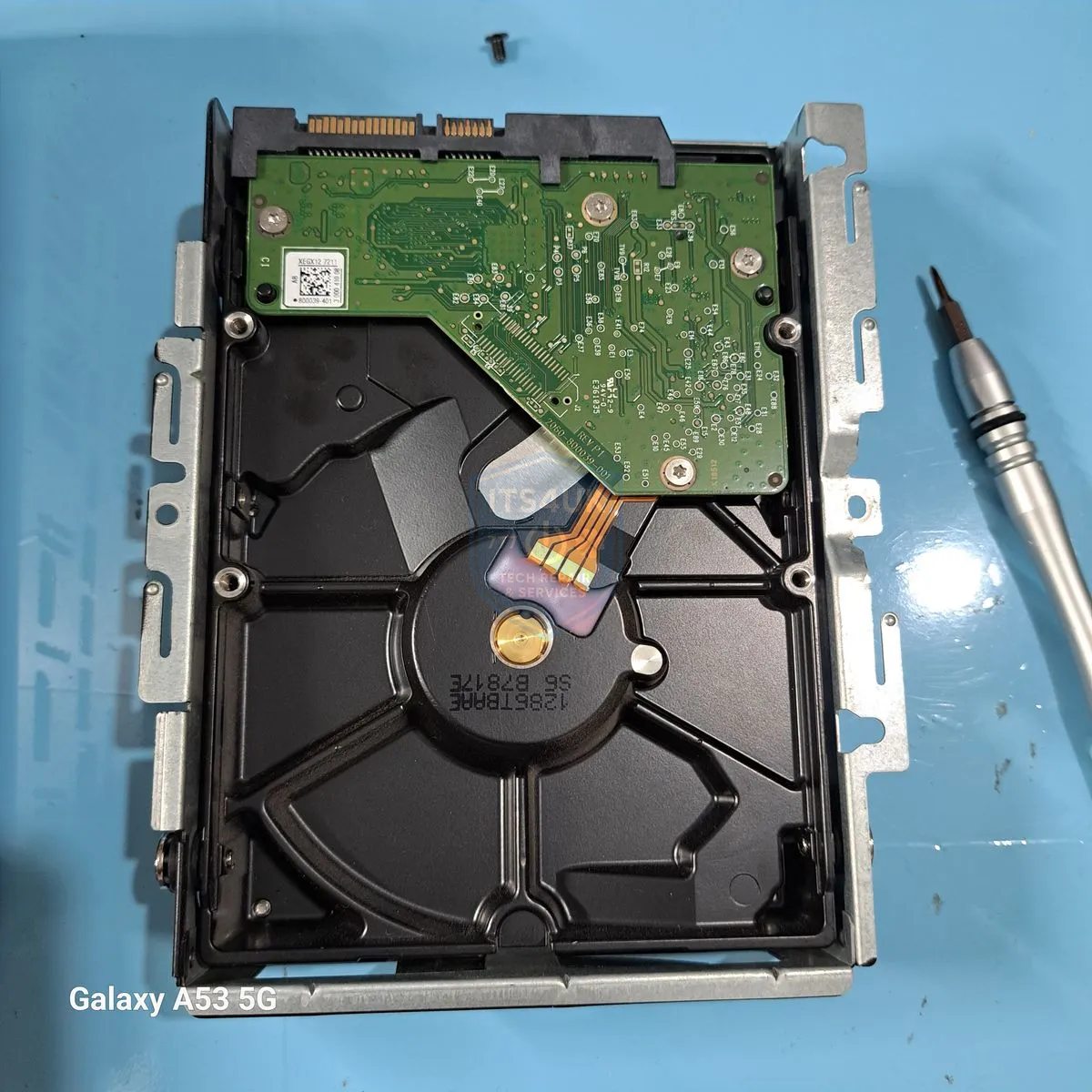 Hard drive circuit board exposed for logic board diagnosis and repair